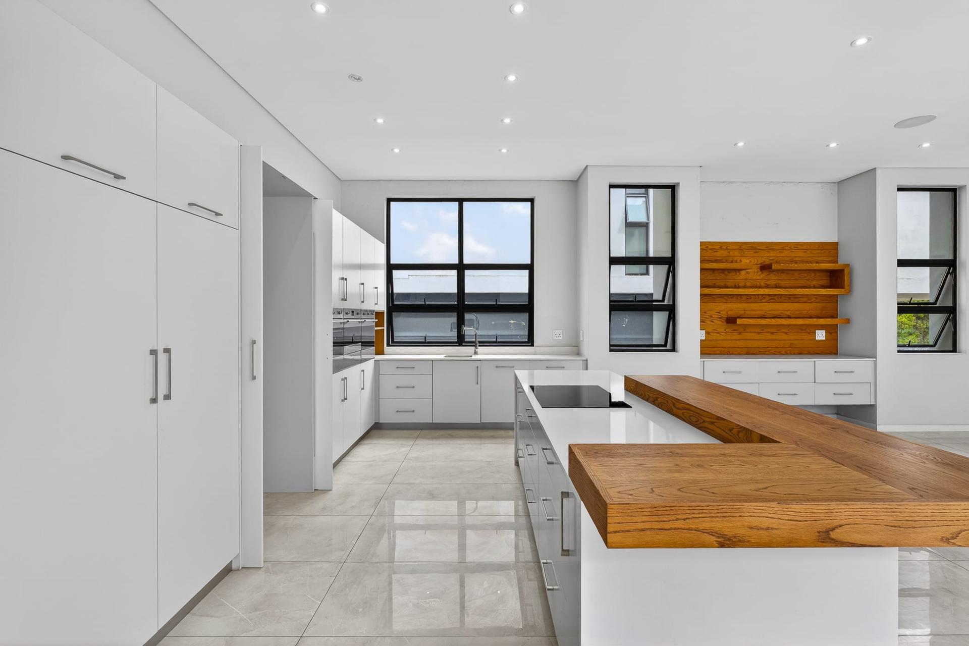 Architectural Triple-Storey Residence with Private Greenbelt Views — photograph 3